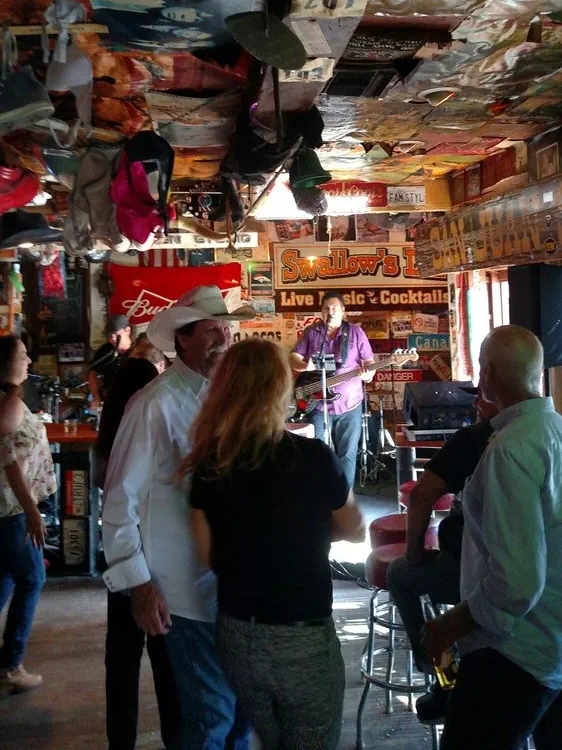 People enjoying live music at Swallows Inn